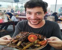 Luke Martin eating non vegetarian food